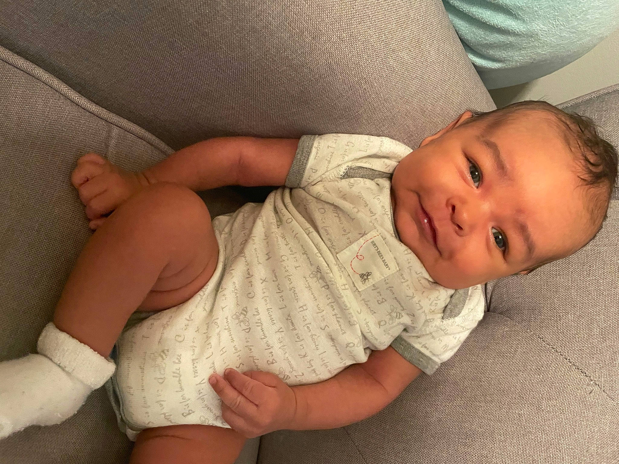 Rich is registered to the contest to win money with this photo: baby, baby_toddler_clothing, cheek, comfort, elbow, facial_expression, finger, hand, human_body, joint, knee, leg, mammal, muscle, nose, person, skin, sleeve, textile, thigh