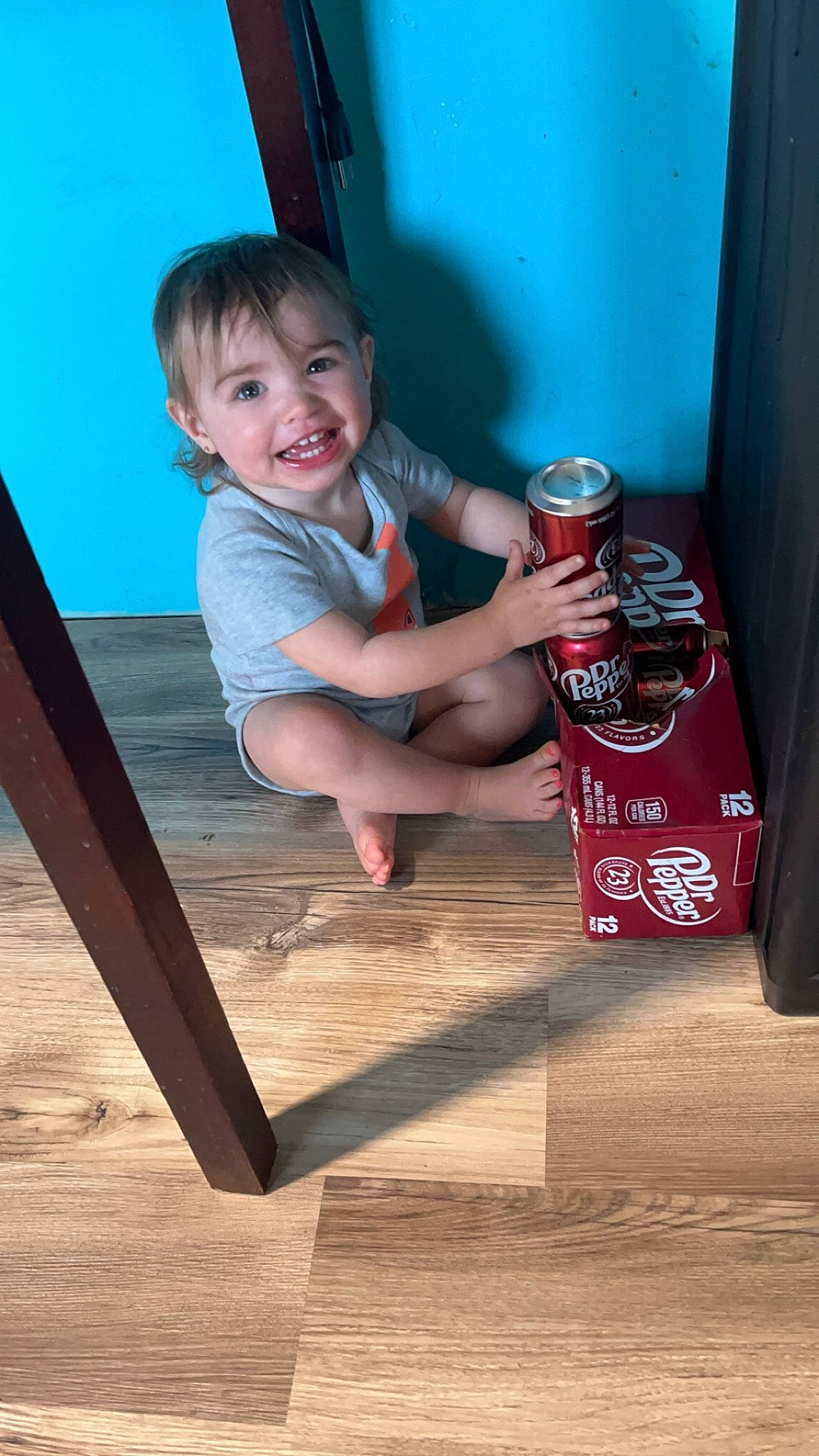 Malaun is registered to the contest to win money with this photo: aluminum_can, baby_toddler_clothing, beverage_can, child, finger, flooring, gas, happy, hardwood, human_leg, joy, leg, person, shorts, smile, thumb, tin, tin_can, toddler, varnish