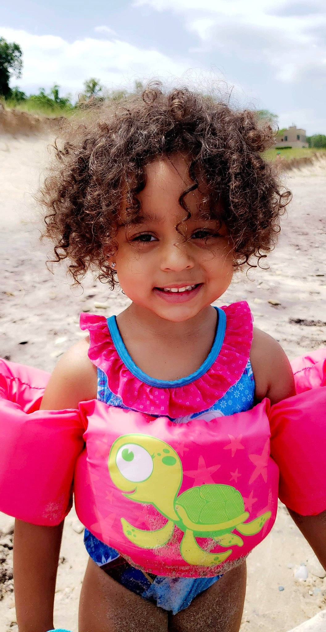 Aryah joined the competition — help win amazing prizes! baby_toddler_clothing, body_of_water, chin, clothing, facial_expression, hair, happy, human, iris, joy, mouth, neck, nose, organ, people_in_nature, person, pink, skin, sleeve, smile