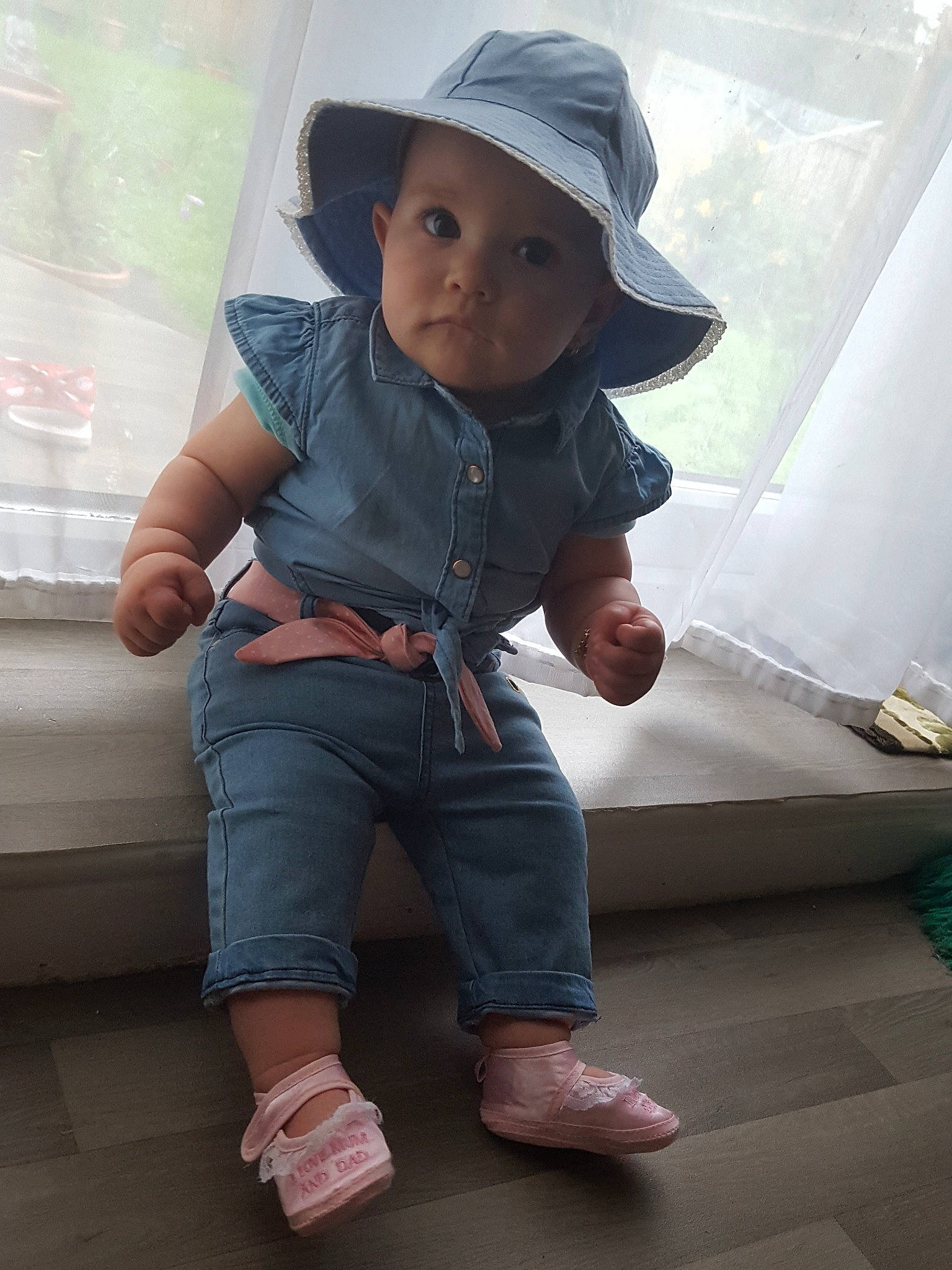Carina is registered to the contest to win money with this photo: baby, child, denim, headgear, headwear, jeans, person, skin, standing, toddler, vacation