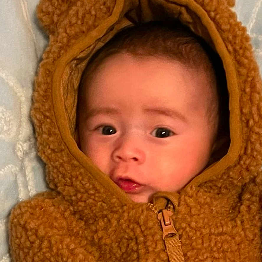 Cervando joined the competition — help win amazing prizes! baby, blanket, bonnet, clothing, coat, face, fleece, hat, head, hood, hoodie, jacket, knitwear, lifejacket, newborn, person, photography, portrait, sweater, sweatshirt