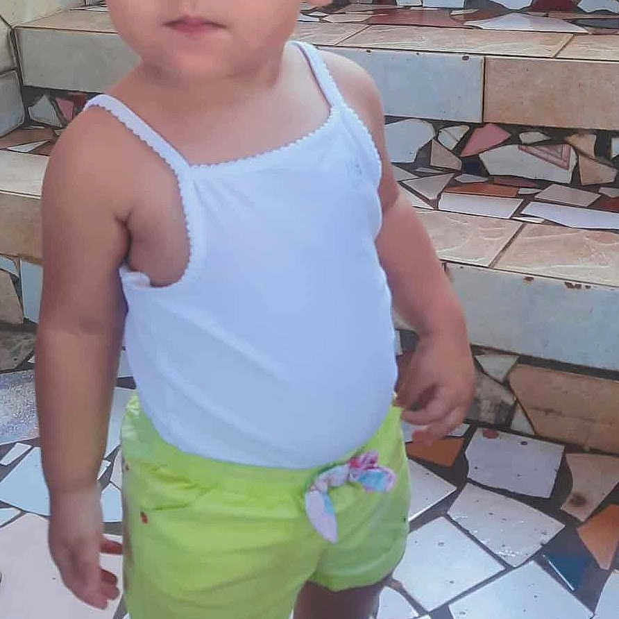 Thaïss is registered to the contest to win money with this photo: casual_clothing, child, closeup, curious, curly_hair, daylight, innocent, lime_shorts, mosaic_floor, mosaic_stairs, outdoor, person, pigtails, portrait, sandals, standing, tile_pattern, toddler, white_tank_top, young_child