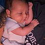 baby, infant, sleeping, arm, tattoo, blanket, person, clothing, smile, face, skin, hand, comfort, rest, cute, indoor, closeup, toddler, soft, cozy