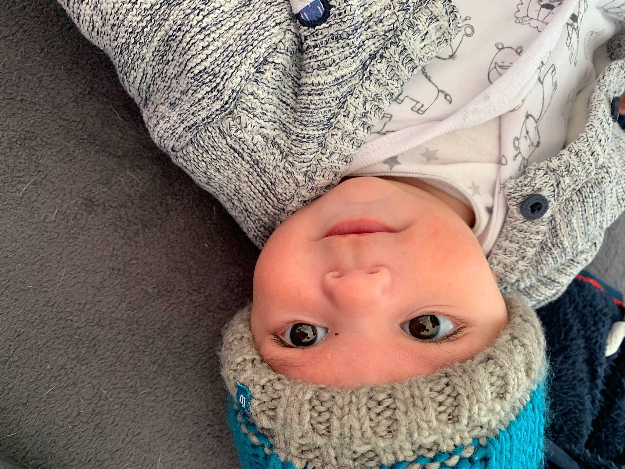 Taylor participe au concours pour gagner de l'argent avec cette photo : baby, cheek, child, close_up, cool, eye, face, hand, head, headgear, headwear, human, knitting, lip, mouth, nose, outerwear, person, skin, textile