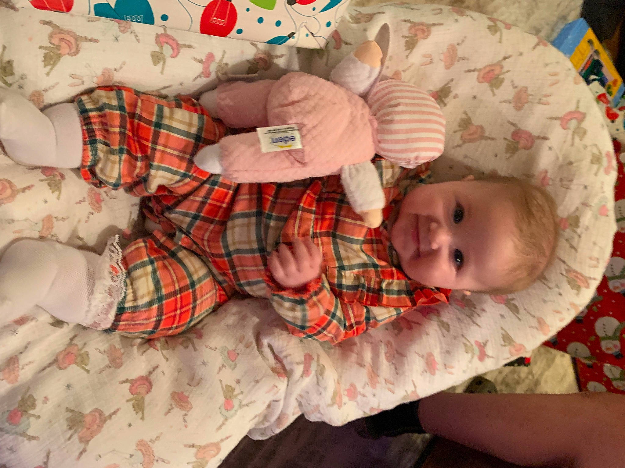 Stella is registered to the contest to win money with this photo: baby, baby_products, baby_toddler_clothing, bed, bedding, bedtime, child, comfort, design, head, joy, linens, mammal, pattern, person, plaid, room, smile, tartan, textile