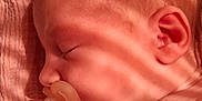 Shelsy participe au concours pour gagner de l'argent avec cette photo : baby, blanket, closeup, ear, face, head, indoors, infant, light, newborn, pacifier, peaceful, portrait, resting, shadow, skin, sleeping, soft_light, striped_shadow, texture