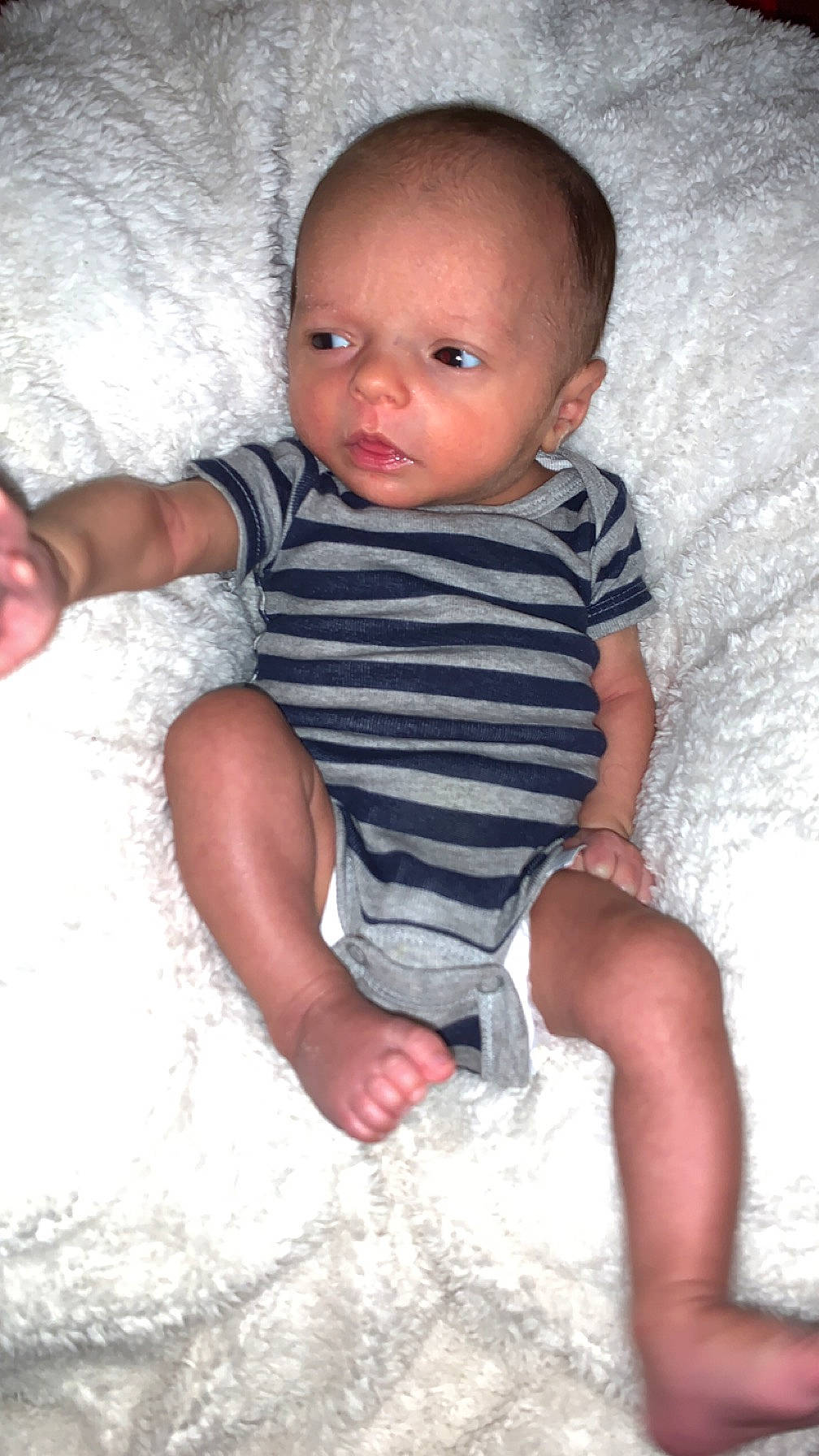 Kash is registered to the contest to win money with this photo: arm, baby, baby_toddler_clothing, beauty, cheek, child, comfort, finger, flash_photography, fun, happy, linens, organ, pattern, person, pink, sitting, skin, sleeve, stomach