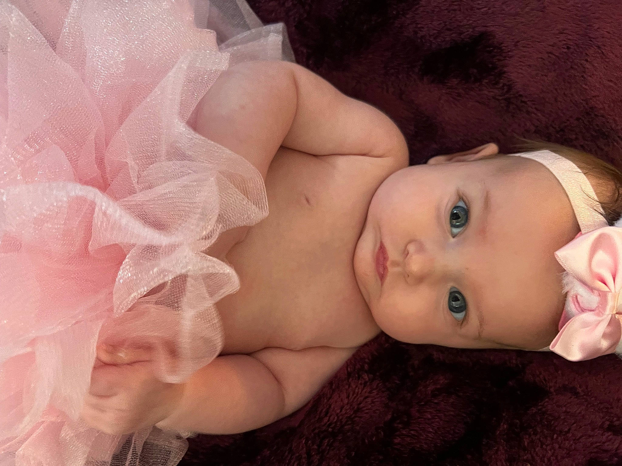 Felicity is registered to the contest to win money with this photo: baby, baby_toddler_clothing, cheek, chest, child, close_up, eyelash, finger, flash_photography, hand, happy, headgear, headwear, iris, lip, nose, person, pink, rose, skin