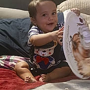 Ayden joined the competition — help win amazing prizes! baby, child, smiling, sitting, bed, blanket, pillow, cute_outfit, bear_design, decorative_plate, home_interior, indoors, infant, happy, playful, person, foot, hand, short_sleeves, casual