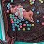 Ella-May is registered to the contest to win money with this photo: baby, child, playpen, plastic_balls, blanket, pink_ball, blue_ball, yellow_ball, green_ball, floor, socks, white_top, curly_hair, indoor, toy, infant, play_area, person, smiling, recreation