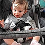 Ella-May joined the competition — help win amazing prizes! baby, child, stroller, seatbelt, pink_socks, curly_hair, blue_eyes, indoor, clothing, soft_fabric, baby_clothes, cute, infant, portrait, seat, baby_accessory, smiling, toddler, sitting, baby_girl