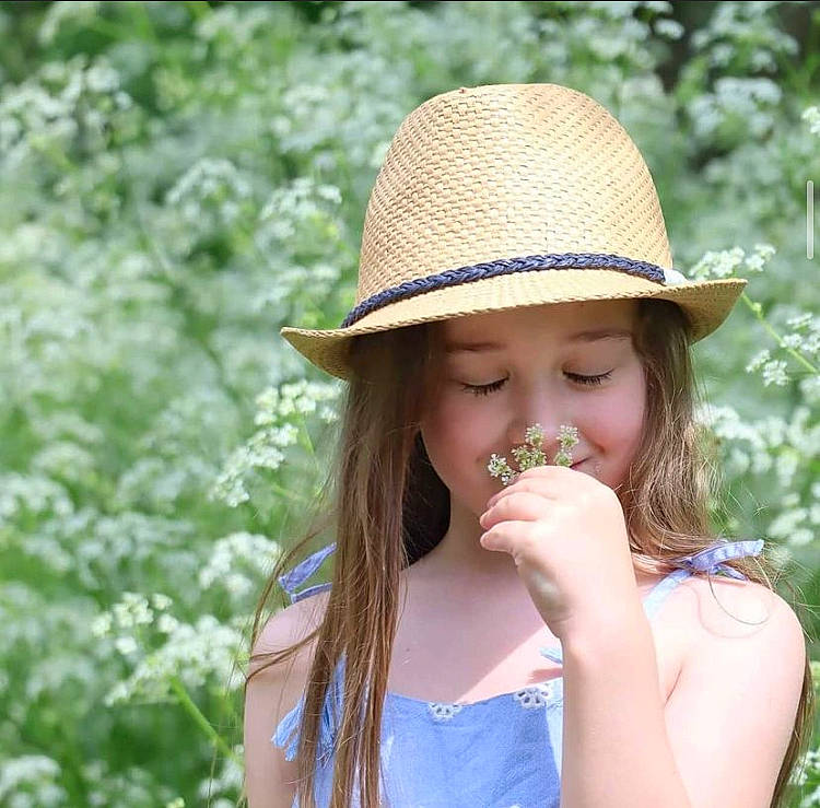 Athena is registered to the contest to win money with this photo: clothing, dress, eye, finger, fruit, grass, hair, hairstyle, happy, hat, head, headwear, joy, leaf, lip, nature, organ, people_in_nature, person, plant