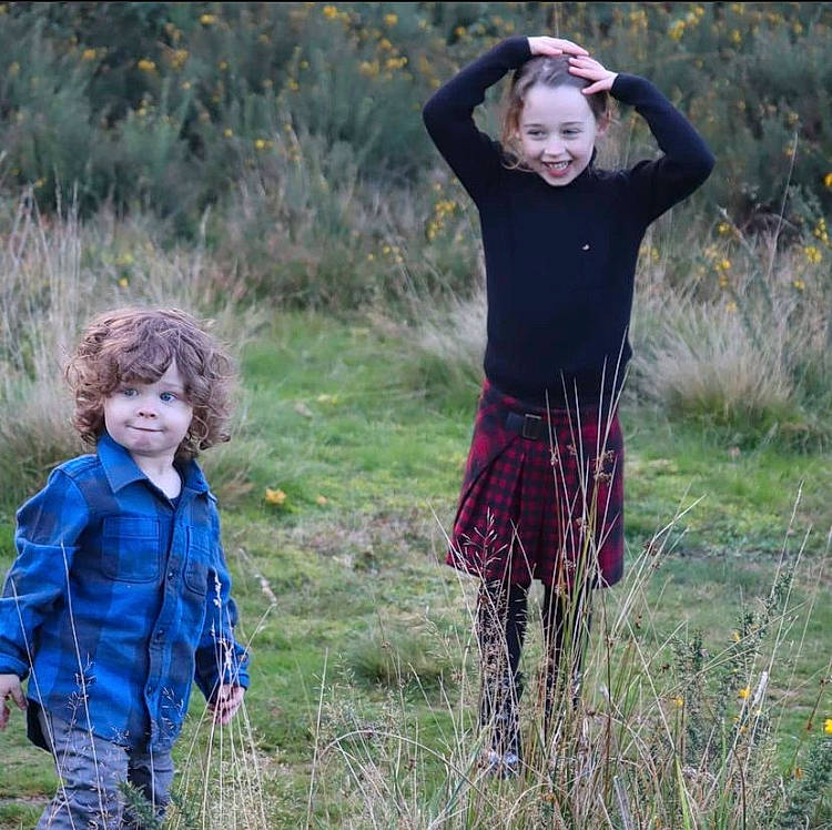 Oakley is registered to the contest to win money with this photo: child, fun, gesture, grass, grass_family, grassland, happy, joy, landscape, leisure, meadow, natural_landscape, outerwear, people_in_nature, person, plant, prairie, recreation, smile, soil