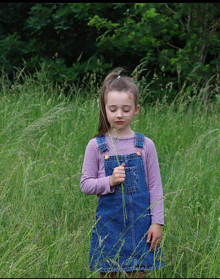 Willow joined the competition — help win amazing prizes! baby_toddler_clothing, botany, day_dress, dress, electric_blue, grass, grass_family, grassland, happy, meadow, one_piece_garment, pattern, people_in_nature, person, plant, prairie, purple, sleeve, summer, terrestrial_plant