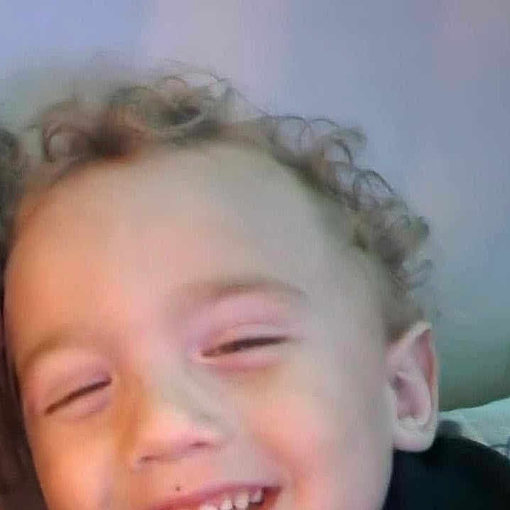 Aiden joined the competition — help win amazing prizes! child, toddler, smiling, curly_hair, face, happy, indoor, portrait, closeup, person, head, light_skin, casual_clothing, cute, young_child, expression, joy, human, baby, cheerful