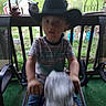 Aiden joined the competition — help win amazing prizes! child, cowboy_hat, rocking_horse, porch, outdoor, greenery, lantern, wooden_railing, toy, boy, motion_blur, casual_clothing, playtime, furniture, chair, daylight, hat, person, grass, backyard