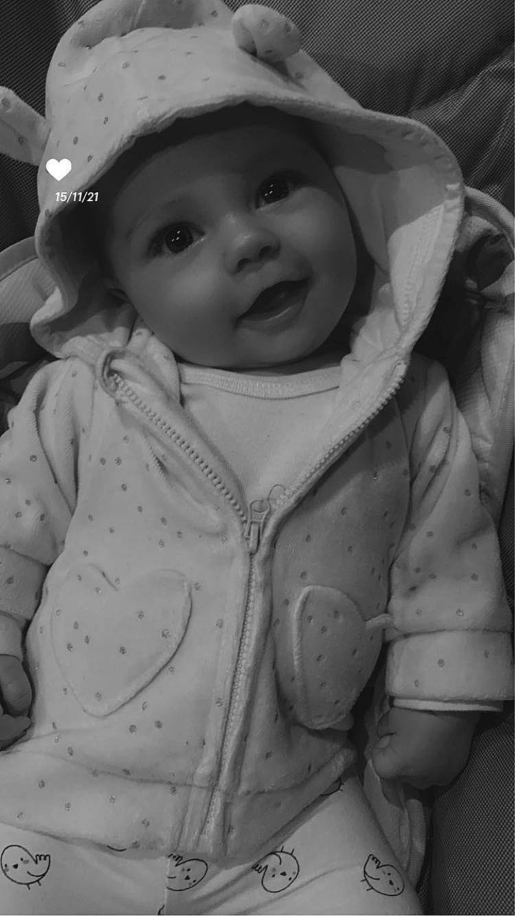 Elyana a rejoint le concours — aidez-le/la à gagner de superbes lots ! baby, baby_toddler_clothing, black, black_and_white, cap, cheek, eye, eyebrow, face, facial_expression, headwear, iris, lip, mouth, nose, organ, outerwear, person, photograph, skin