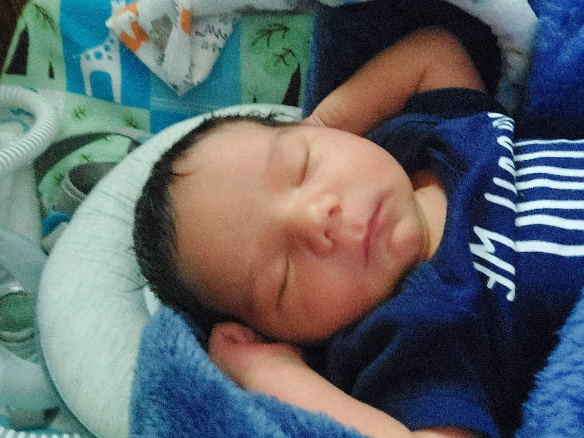 Gary is registered to the contest to win money with this photo: baby, baby_products, baby_sleeping, baby_toddler_clothing, bedtime, cheek, child, comfort, electric_blue, eyebrow, linens, mouth, nap, nose, person, room, sleep, sleeve, smile, toddler