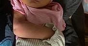 Mia is registered to the contest to win money with this photo: adult, arms, baby, blanket, closed_eyes, cozy, face, family, head_wrap, held, indoor, infant, nap, newborn, peaceful, pink, portrait, sleeping, striped_clothing, turban