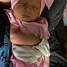 adult, arms, baby, blanket, closed_eyes, cozy, face, family, head_wrap, held, indoor, infant, nap, newborn, peaceful, pink, portrait, sleeping, striped_clothing, turban
