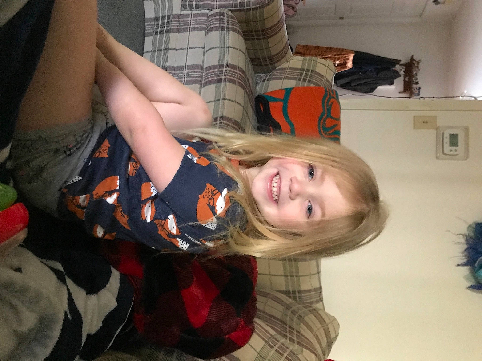 Cheyenne joined the competition — help win amazing prizes! bangs, blond, brown_hair, child, elbow, fun, hair_coloring, happy, human_leg, joy, knee, long_hair, party, pattern, person, plaid, room, sitting, smile, tartan
