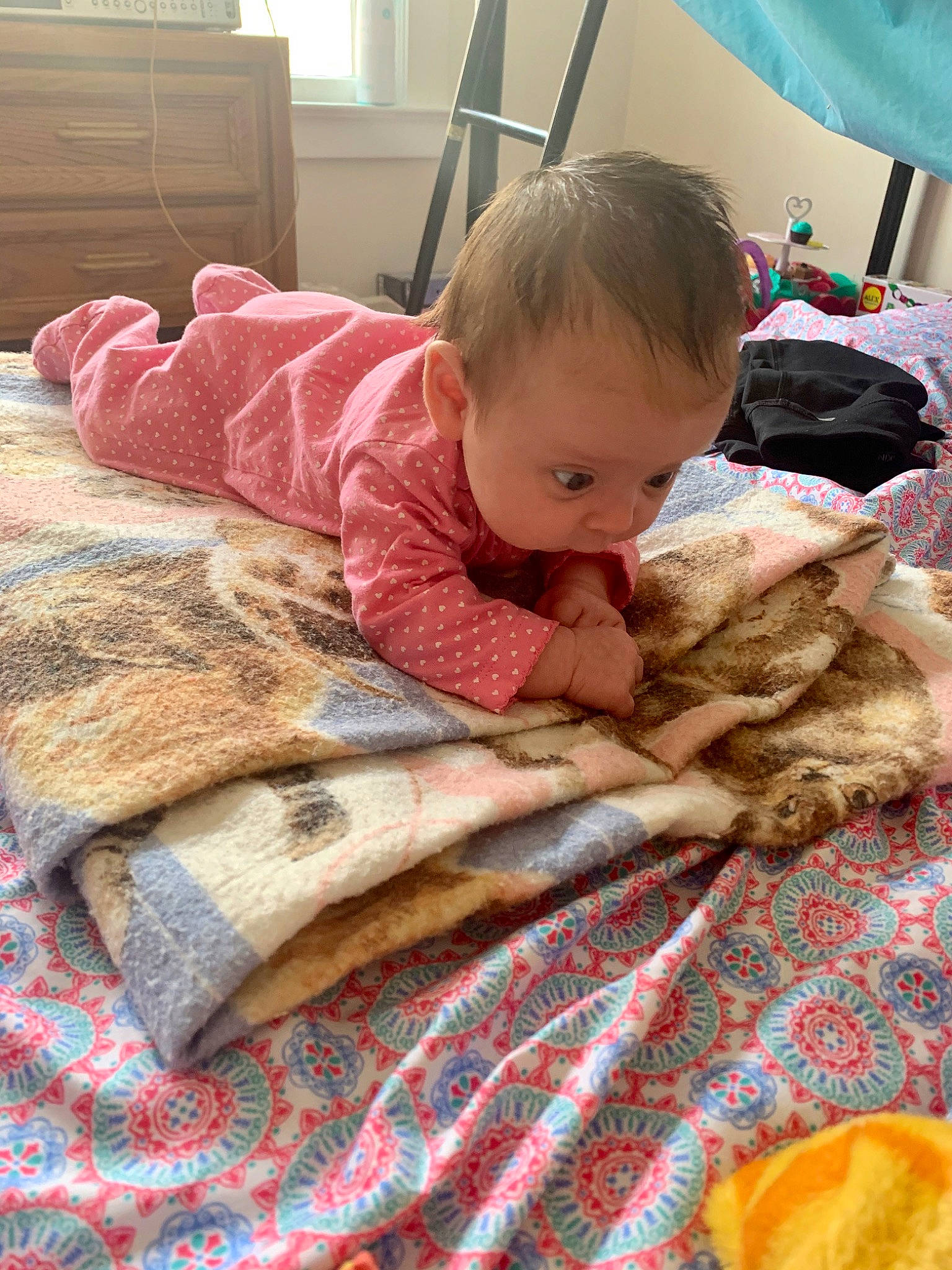 Stormy is registered to the contest to win money with this photo: baby, blanket, child, linens, nap, person, play, room, textile, toddler