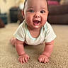 Isabella is registered to the contest to win money with this photo: baby, crawling, carpet, smiling, happy, indoor, child, person, face, eyes, hands, clothing, short_sleeves, home, living_room, cute, infant, skin, expression, portrait
