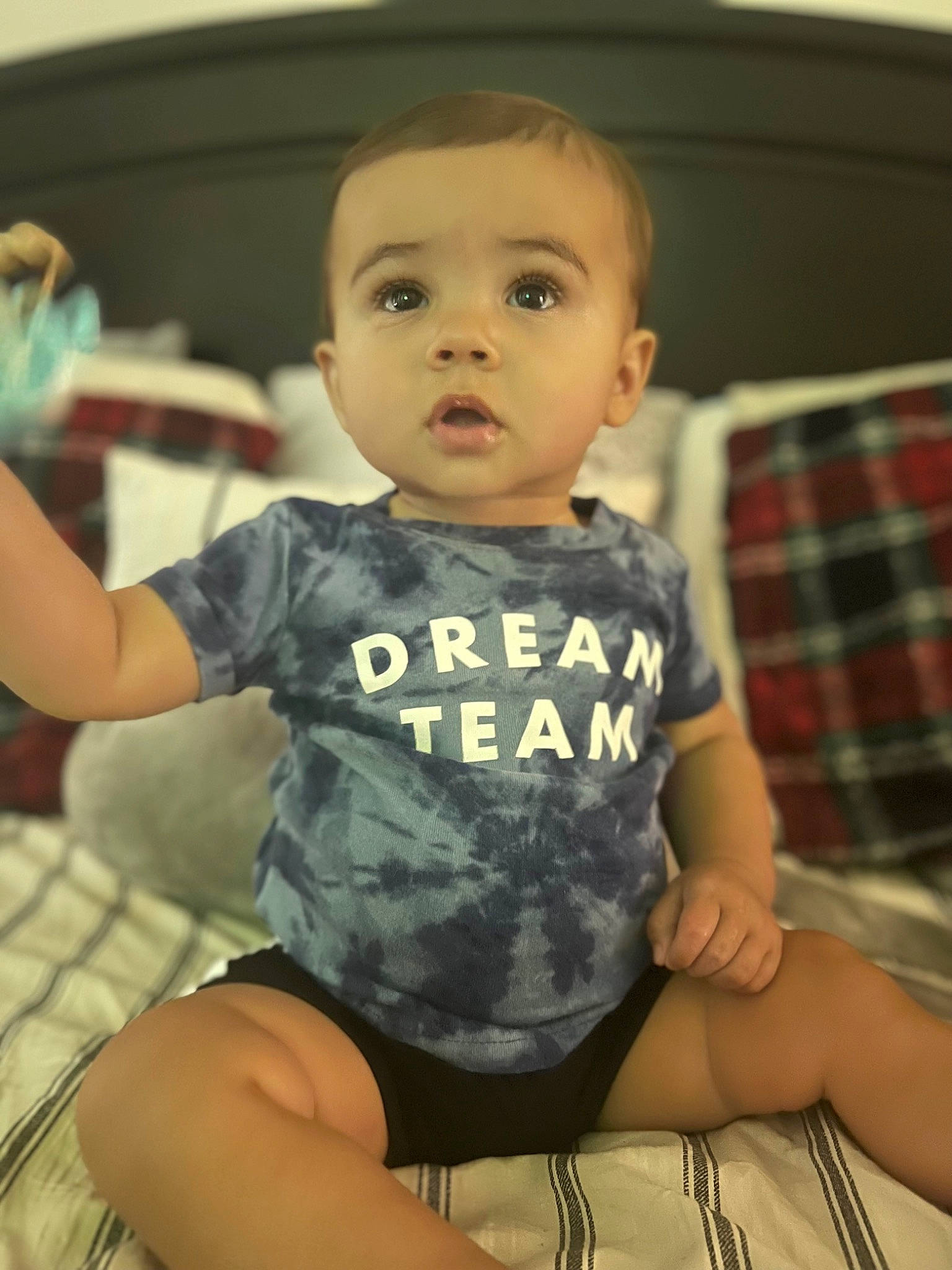 Greysen is registered to the contest to win money with this photo: baby, baby_toddler_clothing, cheek, child, comfort, finger, fun, happy, head, human_leg, iris, pattern, person, plaid, shoulder, skin, sleeve, smile, tartan, thigh