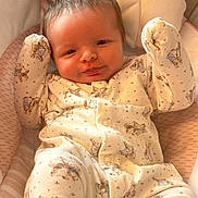 May joined the competition — help win amazing prizes! baby, bed, blanket, clothing, crib, cushion, face, furniture, happy, head, homedecor, infantbed, newborn, pajamas, person, photography, portrait, quilt, sleeping, smile