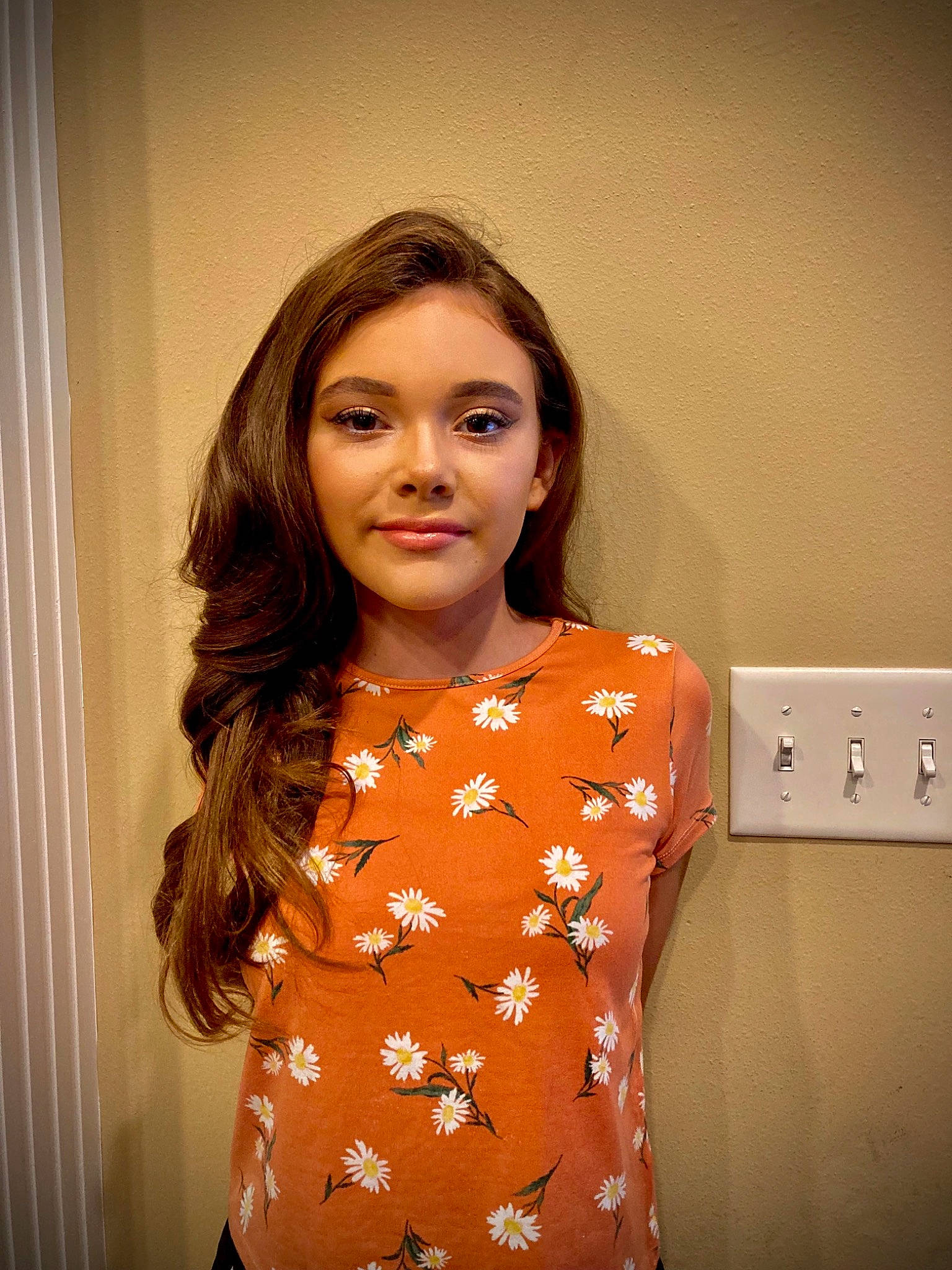 Monroe is registered to the contest to win money with this photo: brown_hair, chin, curtain, day_dress, event, eyelash, face, fashion_design, flash_photography, formal_wear, happy, head, joy, light_switch, lip, lipstick, long_hair, peach, person, sleeve