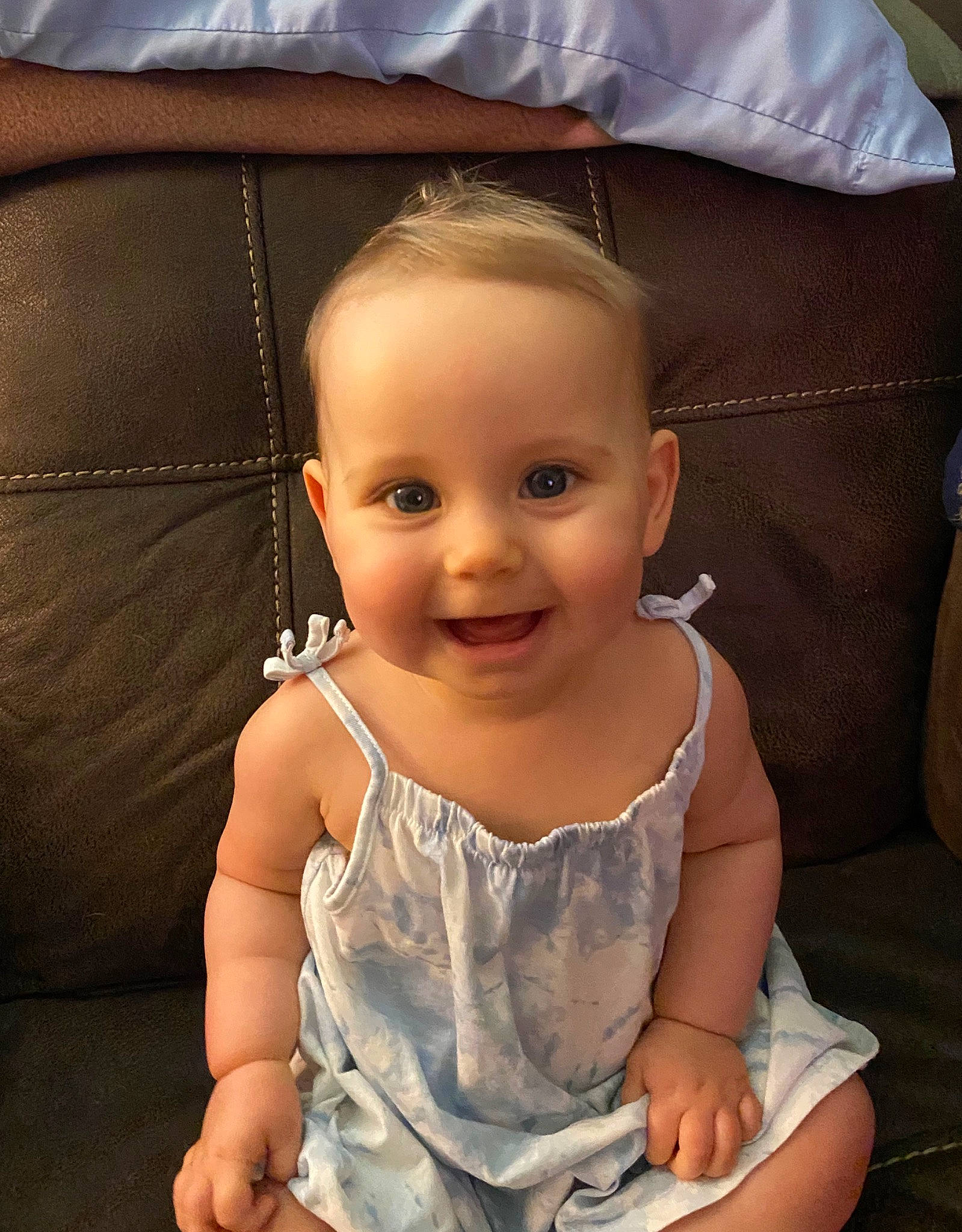 Everleigh Grace is registered to the contest to win money with this photo: arm, baby, cheek, child, eye, face, head, iris, joy, lip, nose, person, sitting, skin, smile, toddler