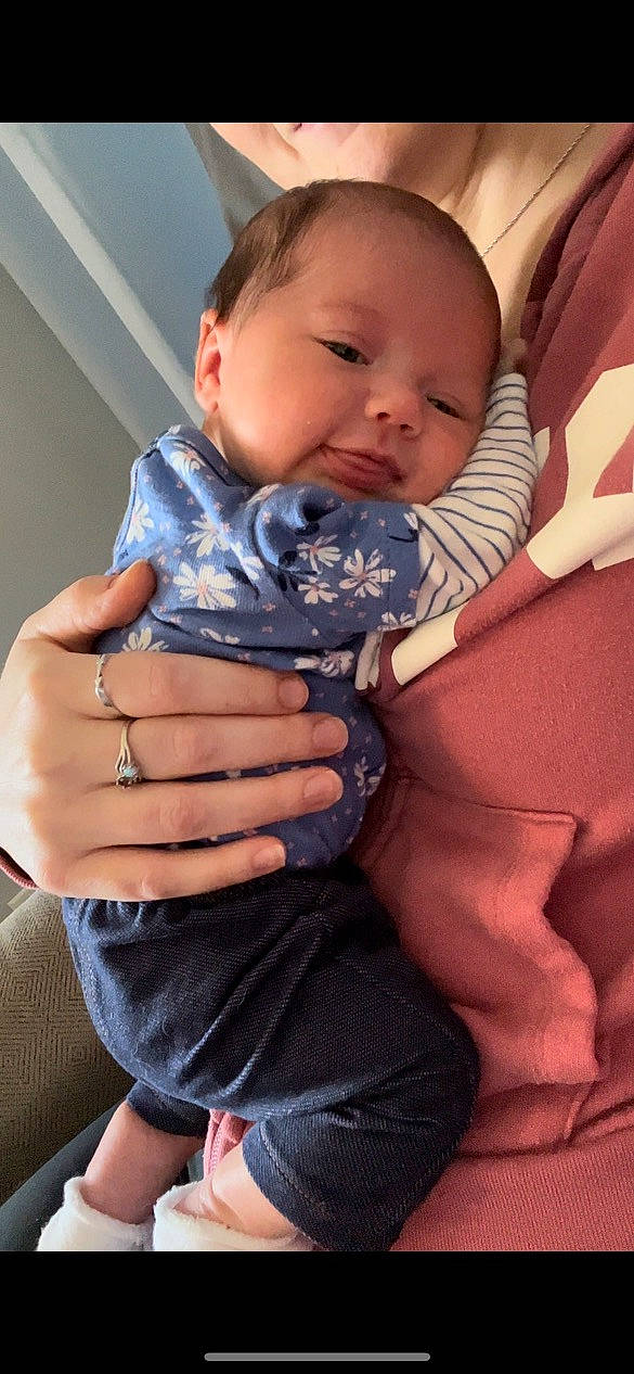 Emersyn is registered to the contest to win money with this photo: azure, baby, baby_toddler_clothing, cheek, comfort, face, finger, gesture, hand, happy, iris, joint, lip, mouth, nail, neck, person, shoulder, skin, sleeve