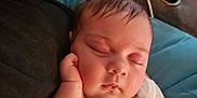 Ellie joined the competition — help win amazing prizes! baby, sleeping, hand, face, infant, clothing, sleeve, couch, pillow, drink, cup_holder, relaxing, indoors, closeup, peaceful, skin, hair, person, rest, comfort