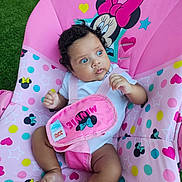 Hanah joined the competition — help win amazing prizes! baby, infant, child, portrait, sitting, pink, minnie_mouse, baby_seat, car_seat, straps, wide_eyed, blue_eyes, curly_hair, white_shirt, colorful, polka_dots, hearts, stars, outdoor, grass