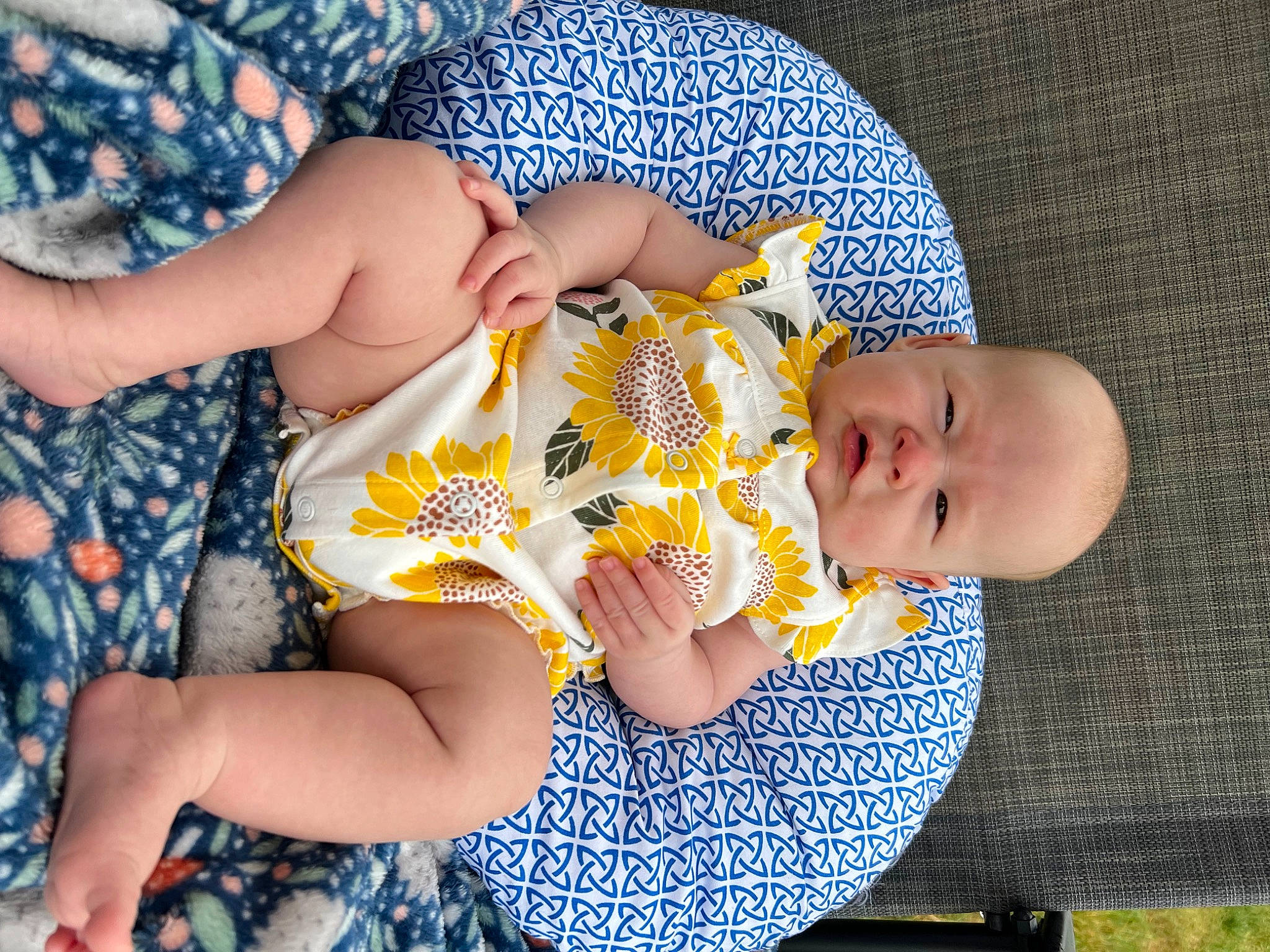 Lila joined the competition — help win amazing prizes! baby, baby_toddler_clothing, blue, child, comfort, finger, foot, fun, happy, headgear, human_leg, knee, lap, leisure, pattern, person, sitting, skin, textile, thigh