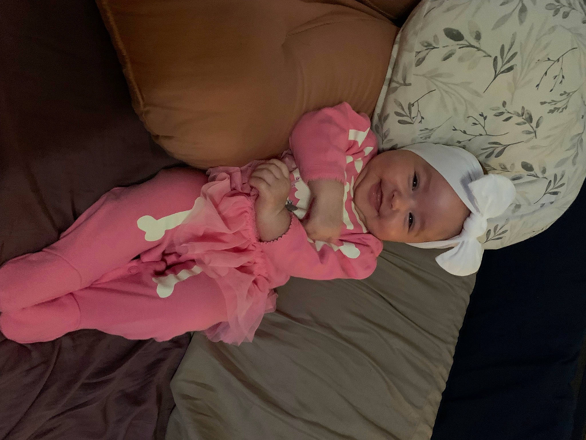 Brexleigh is registered to the contest to win money with this photo: arm, baby, baby_products, baby_toddler_clothing, bedtime, cheek, child, comfort, hat, headwear, joy, linens, magenta, nap, person, pink, room, sitting, skin, sleep