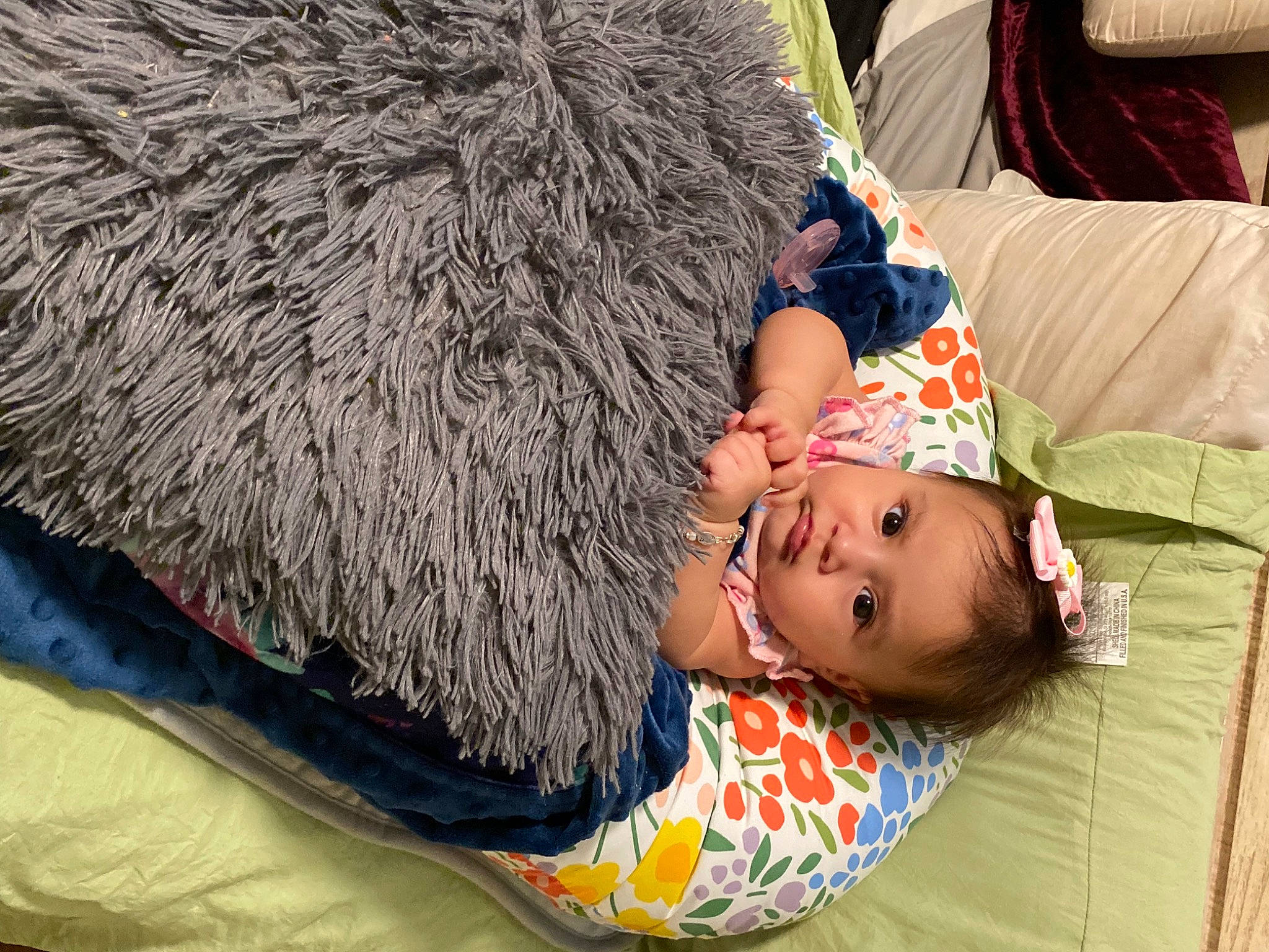 Mia is registered to the contest to win money with this photo: baby, bedding, child, comfort, flooring, fun, fur, grass, hay, leisure, linens, mammal, nap, pattern, person, sleep, textile, toddler, vertebrate, wood