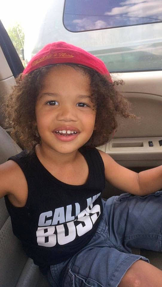 Sir is registered to the contest to win money with this photo: car_seat, child, cool, facial_expression, hat, headgear, joy, person, skin, smile, toddler, tooth