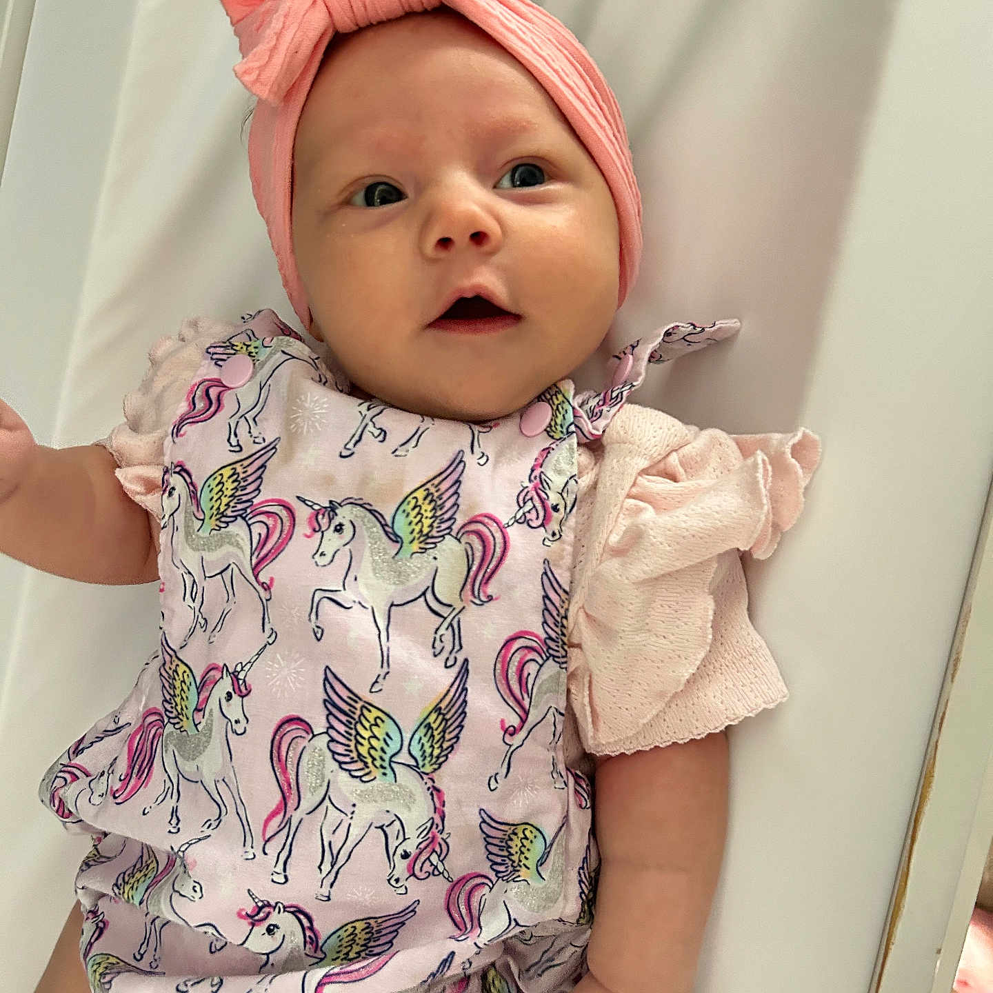 Aurora-Jane is registered to the contest to win money with this photo: accessories, baby, bed, bodypart, bonnet, clothing, crib, dress, face, finger, furniture, hand, hat, head, infantbed, newborn, person, photography, portrait, sleeve