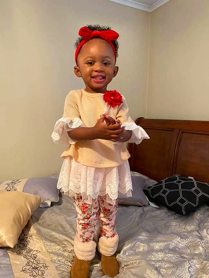 Gabby is registered to the contest to win money with this photo: child, child_model, costume, hair_accessory, headband, joy, leggings, person, shoe, sleeve, tights, toddler