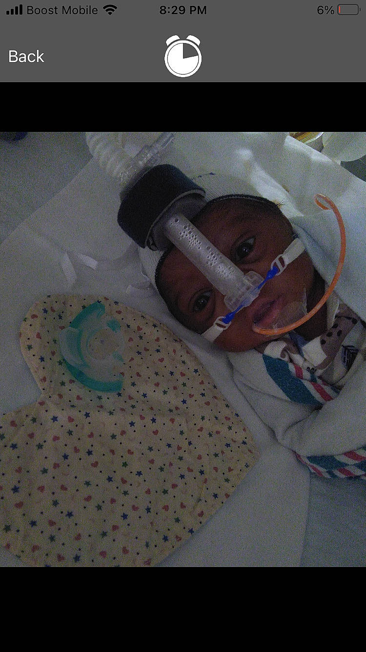 Khylen is registered to the contest to win money with this photo: audio_equipment, baby, baby_products, car_seat, child, comfort, craft, font, hat, health_care, helmet, linens, medical, medical_procedure, multimedia, pattern, person, photo_caption, room, service