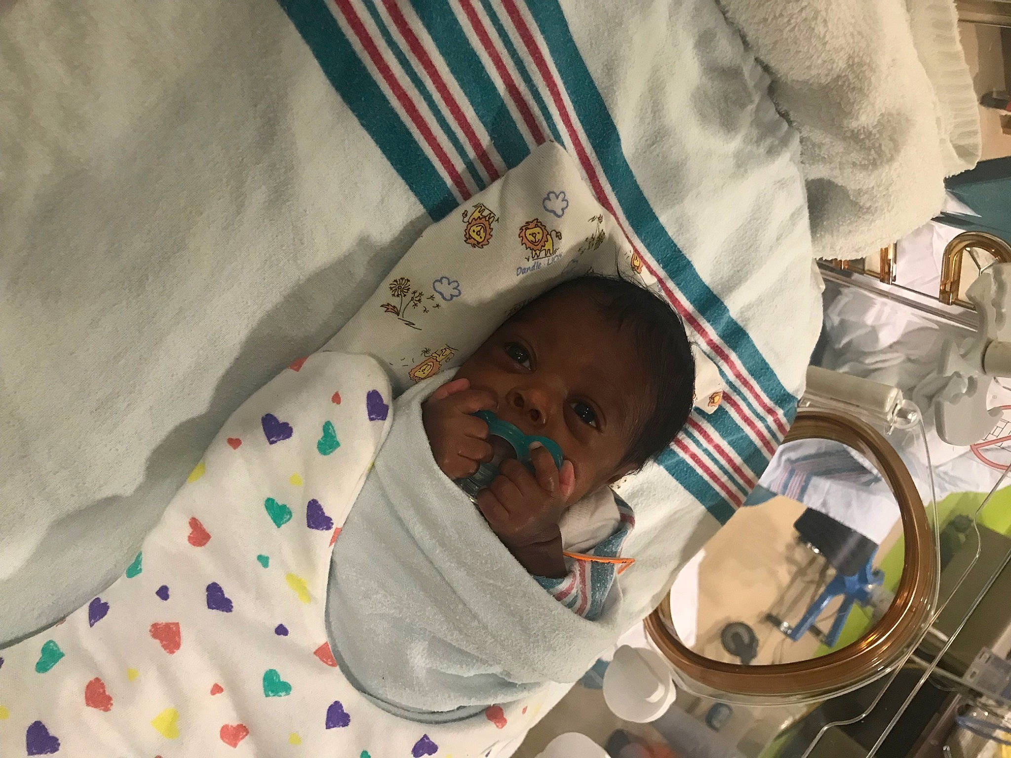 Khalil is registered to the contest to win money with this photo: baby, child, circle, comfort, event, linens, pattern, person, room, toddler