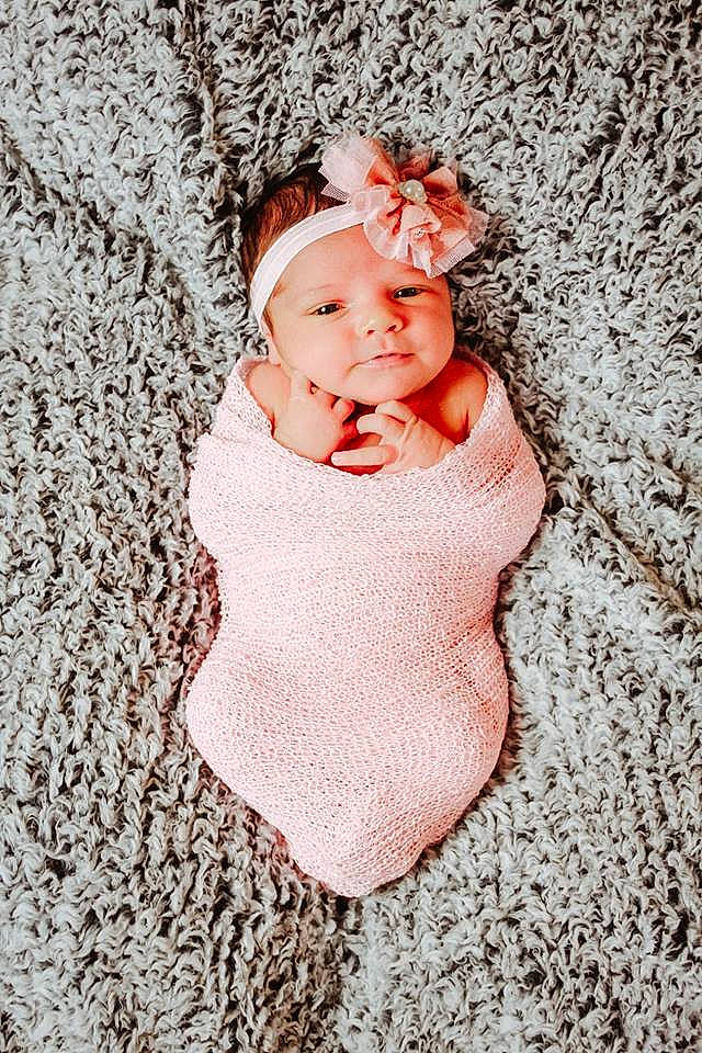 Arizona is registered to the contest to win money with this photo: baby, baby_sleeping, baby_toddler_clothing, cheek, child, hair_accessory, headgear, pattern, person, photograph, photography, pink, portrait_photography, skin, smile, textile, toddler