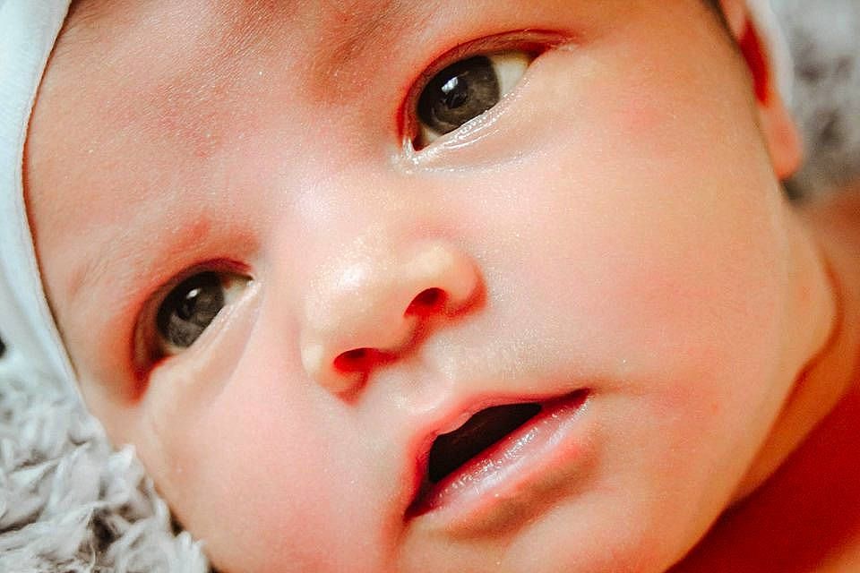 Arizona is registered to the contest to win money with this photo: baby, cheek, child, chin, close_up, eye, eyebrow, eyelash, face, facial_expression, head, iris, lip, mouth, nose, person, photography, portrait_photography, skin, smile
