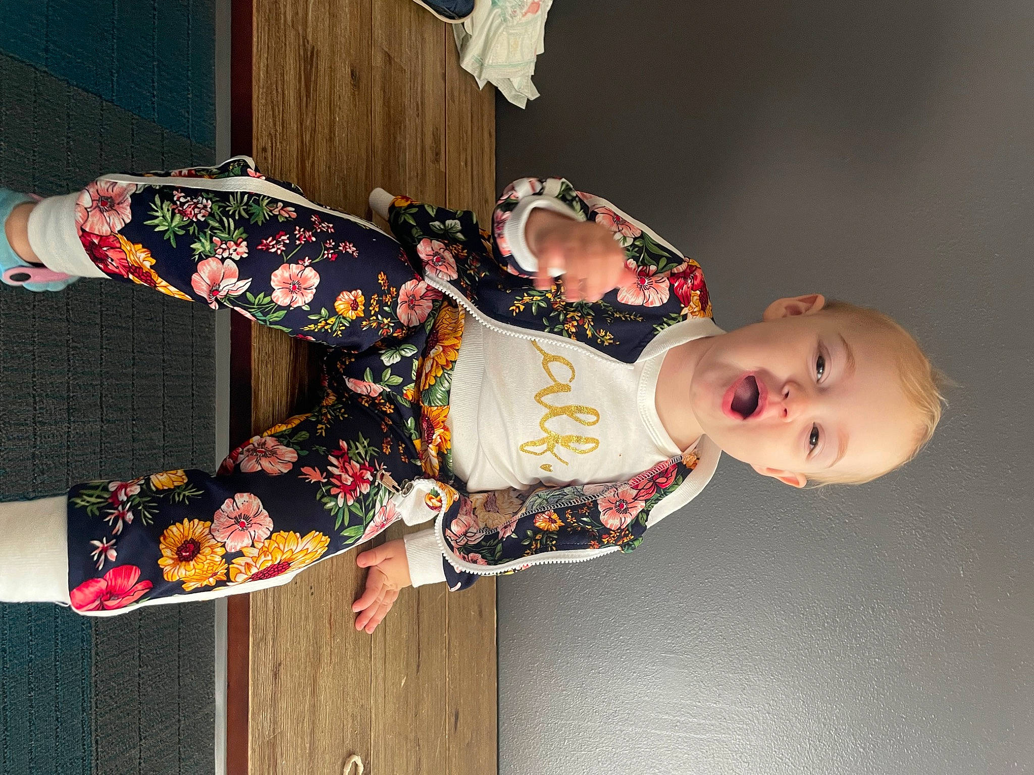Briar is registered to the contest to win money with this photo: art, baby, baby_toddler_clothing, child, costume, event, fashion_accessory, fashion_design, fun, happy, pattern, person, sleeve, toddler, wood, wrist