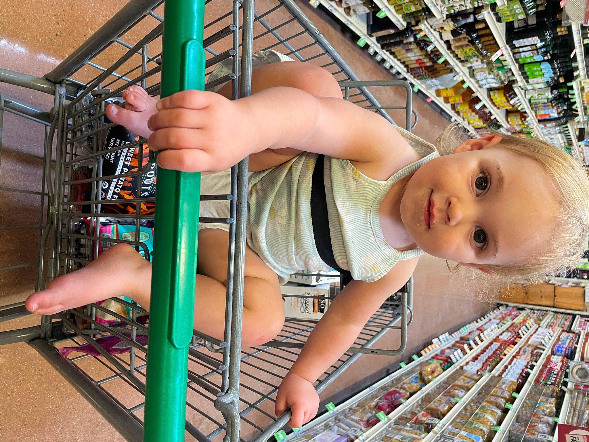 Briar is registered to the contest to win money with this photo: amusement_park, amusement_ride, barefoot, calf, child, chin, city, foot, fun, happy, human_leg, leisure, organ, person, play, recreation, shopping, thigh, toddler, toe