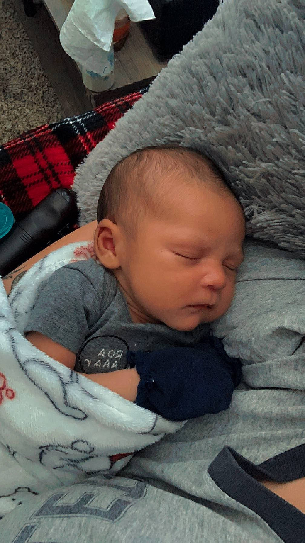 Dimitry is registered to the contest to win money with this photo: baby, baby_products, baby_sleeping, baby_toddler_clothing, cap, carmine, cheek, child, comfort, head, linens, nose, pattern, person, plaid, sitting, skin, tartan, textile, toddler