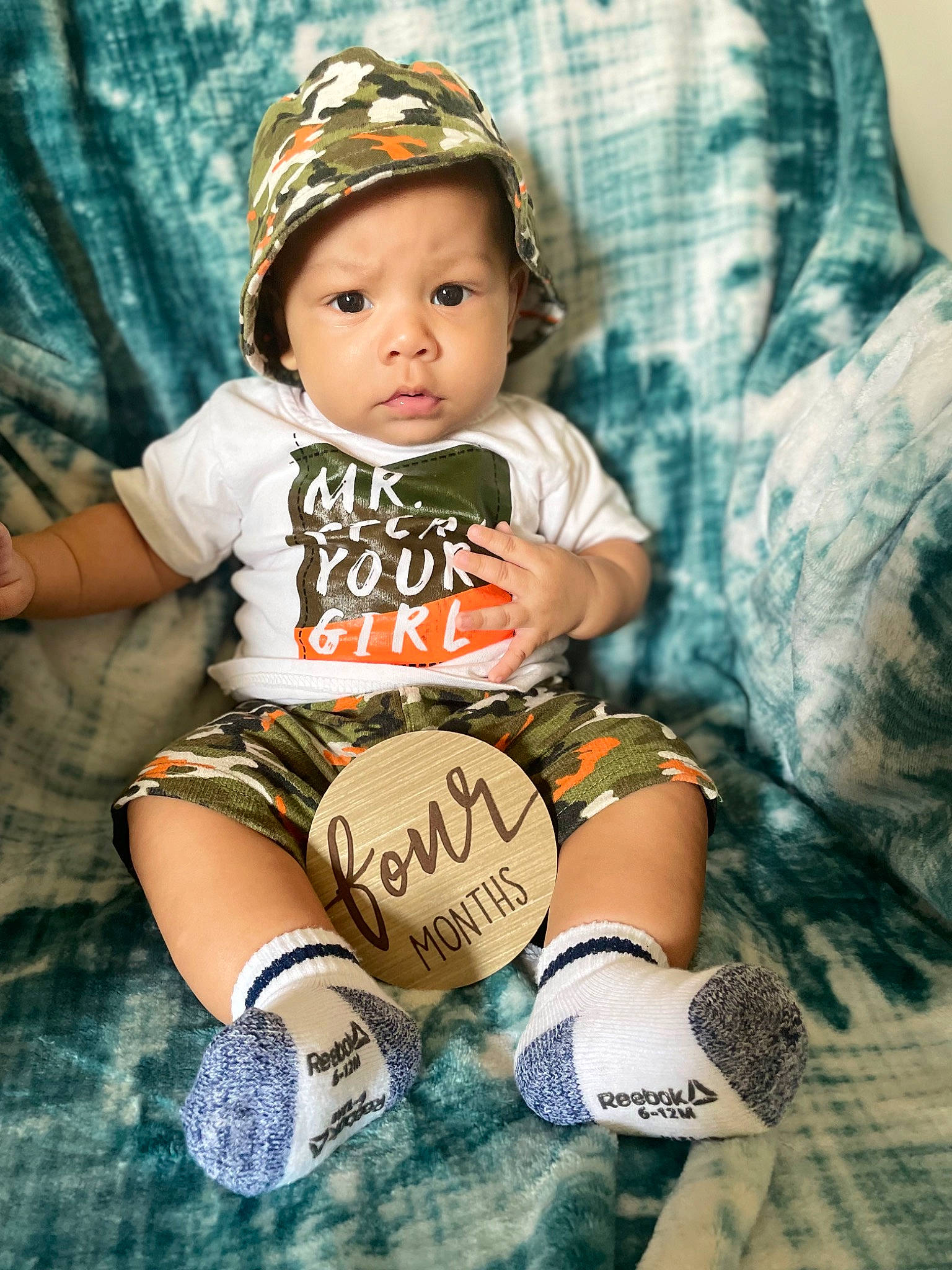 Kaison is registered to the contest to win money with this photo: baby, baby_toddler_clothing, cap, child, cool, eye, face, flash_photography, fun, grass, happy, headwear, mammal, pattern, person, photograph, shoe, sitting, sleeve, t_shirt