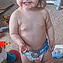toddler, child, smiling, barefoot, indoor, carpet, messy, chocolate, diaper, toys, playful, hair_tie, person, young_child, standing, happy, cute, home, floor, baby