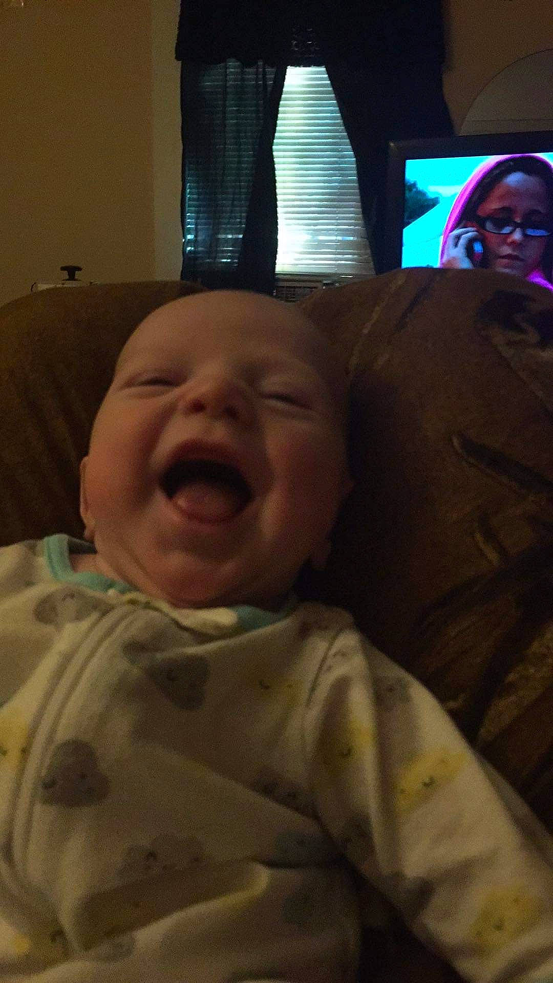 Jeffery is registered to the contest to win money with this photo: baby, cheek, child, comfort, curtain, event, eye, face, facial_expression, fun, happy, jaw, mouth, nose, person, room, skin, smile, television, textile